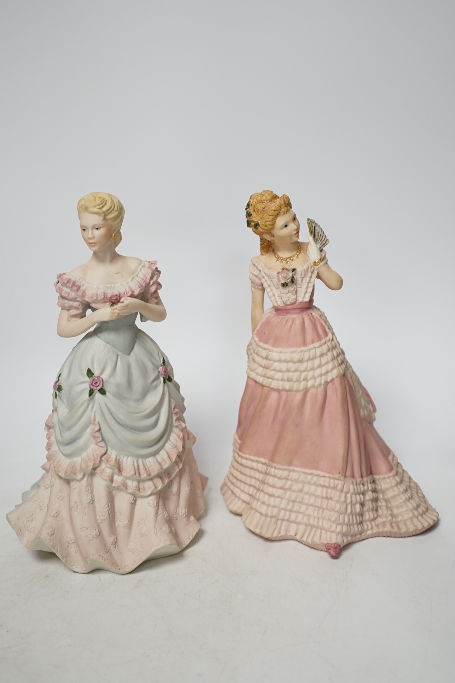 A bisque planter and a pair of Coalport figures, figures 21cm high